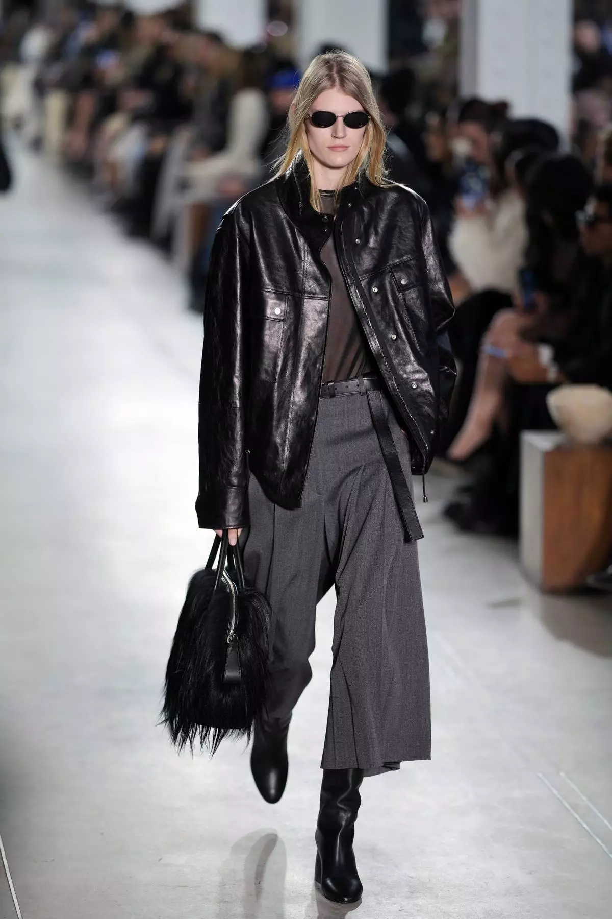 A model walks the runway during the Michael Kors Fall/Winter 2025 fashion show as part of New York Fashion Week on Tuesday, Feb. 11, 2025, at Terminal Warehouse in New York. (Photo by Charles Sykes/Invision/AP)