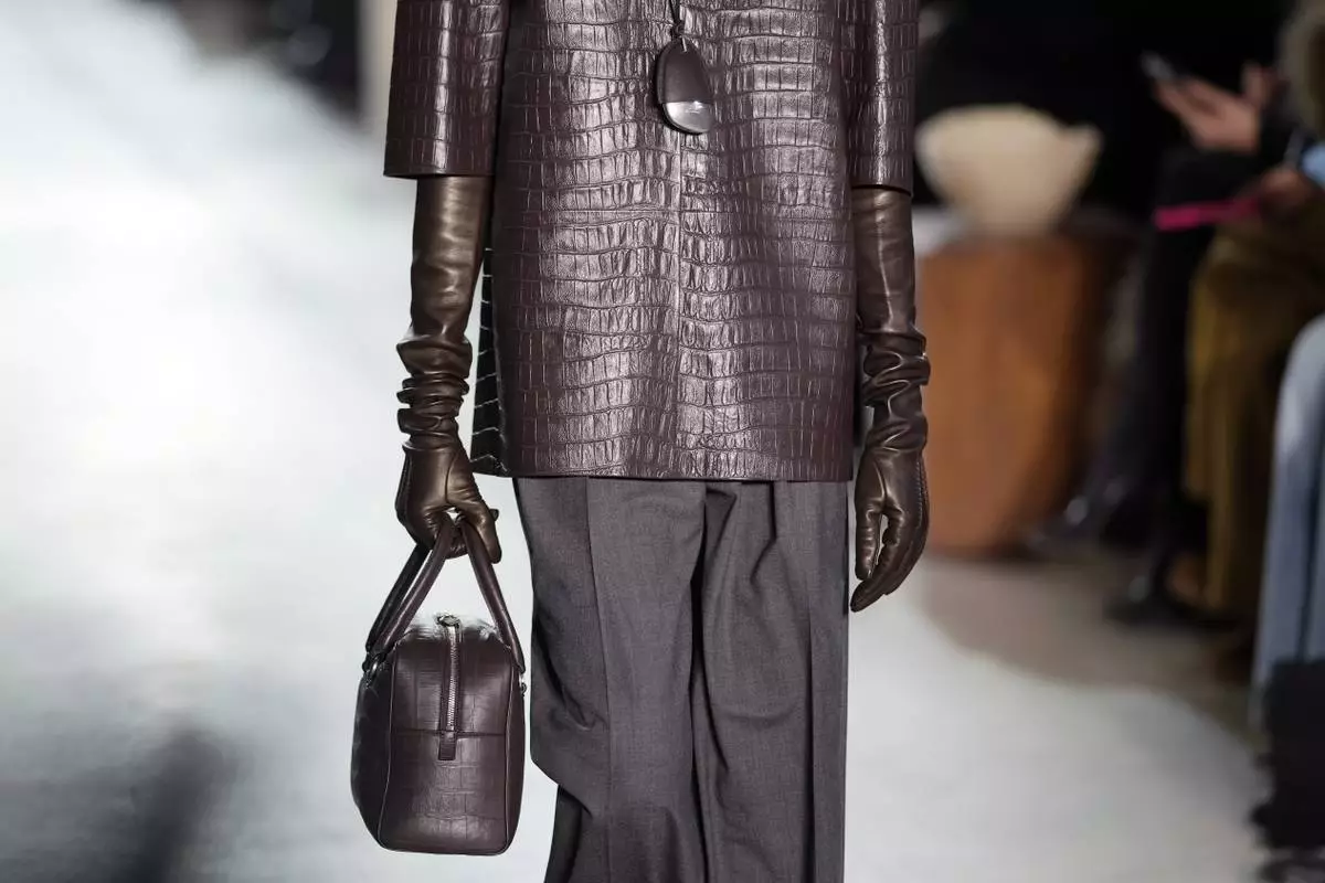 A model walks the runway during the Michael Kors Fall/Winter 2025 fashion show as part of New York Fashion Week on Tuesday, Feb. 11, 2025, at Terminal Warehouse in New York. (Photo by Charles Sykes/Invision/AP)