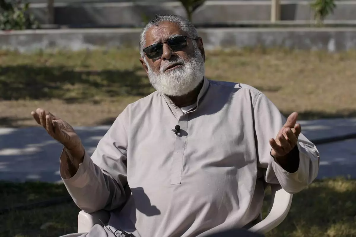 Khuda Bakhsh Hashim, a retired teacher, speaks during an interview with The Associated Press in the coastal city of Gwadar, in the southwest Pakistani province of Balochistan, Jan. 15, 2025. (AP Photo/Anjum Naveed)
