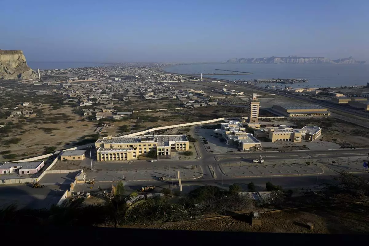 A view of newly developing area, bottom, and downtown area seen from a hilltop in the coastal city of Gwadar, in the southwest Pakistani province of Balochistan, Jan. 14, 2025. (AP Photo/Anjum Naveed)