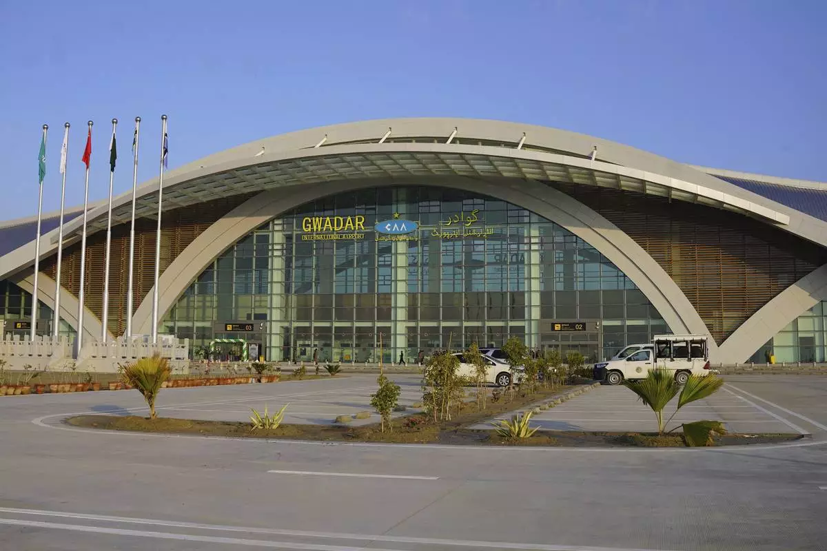 This Jan. 10, 2025, photo provided by Pakistan Airports Authority on Friday, Feb. 21, 2025, shows security forces officials outside the newly constructed Gwadar airport, in Pakistan. (Pakistan Airports Authority via AP)