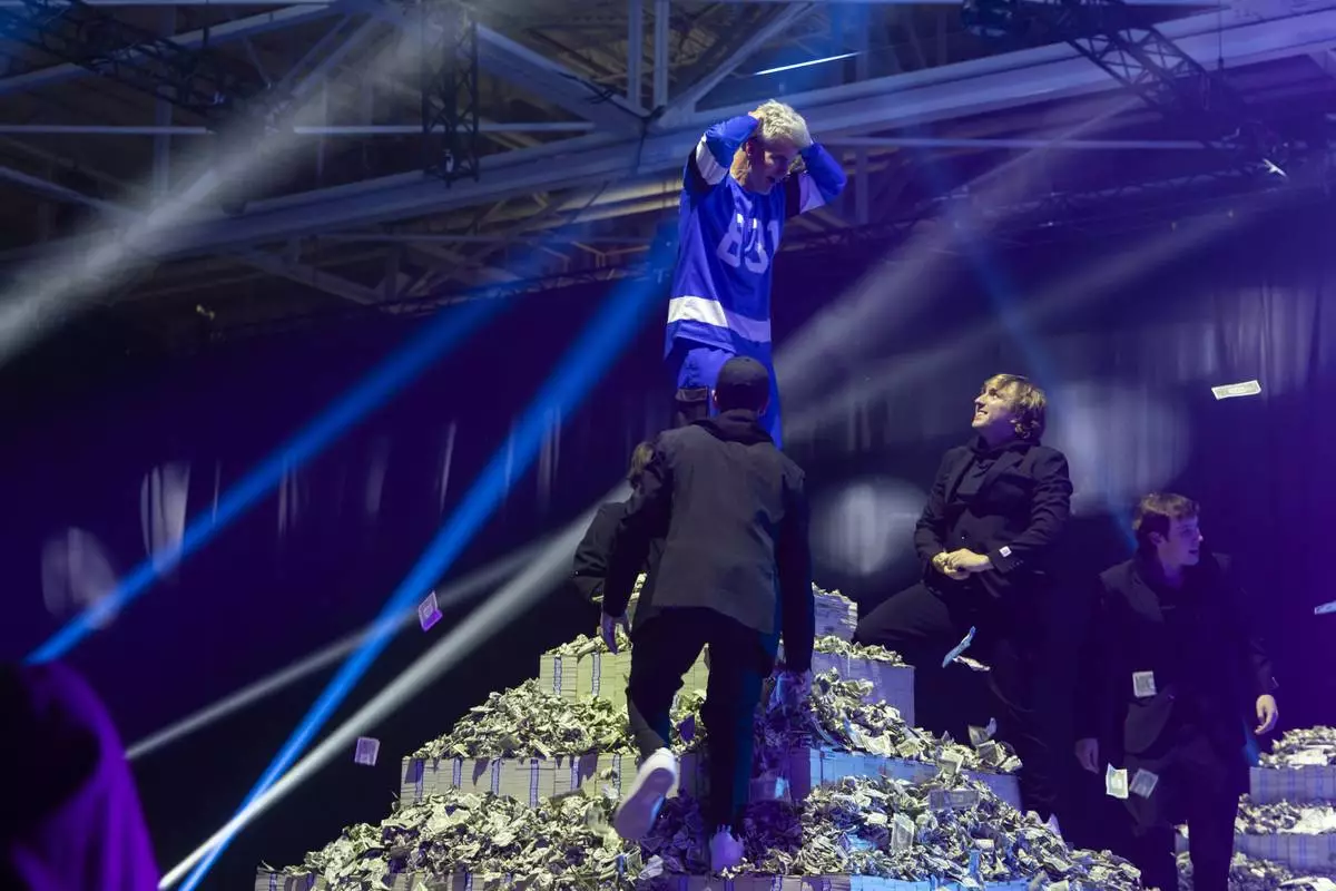 Jeffrey Randall Allen, winner of competition TV show "Beast Games," stands atop his $10 million grand prize. (Photo: Business Wire)