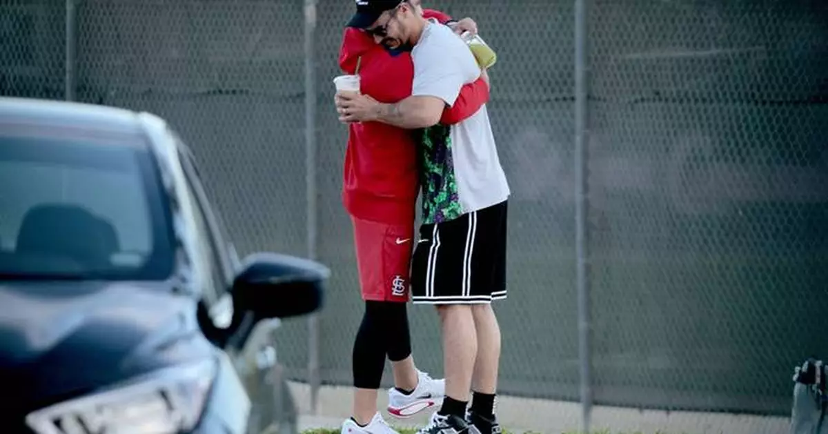 Nolan Arenado reports to camp after the Cardinals tried to trade him in the offseason