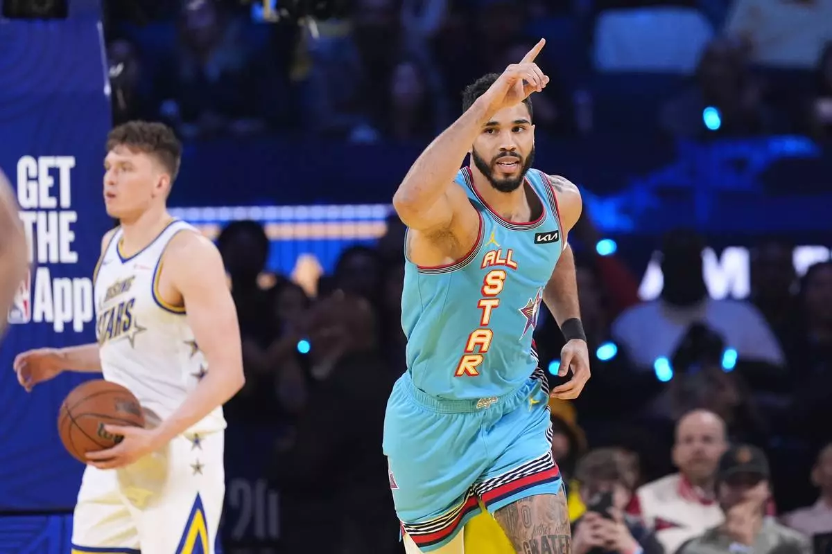 Boston Celtics guard Jayson Tatum reacts after scoring during the NBA All-Star basketball game Sunday, Feb. 16, 2025, in San Francisco. (AP Photo/Godofredo A. Vásquez)
