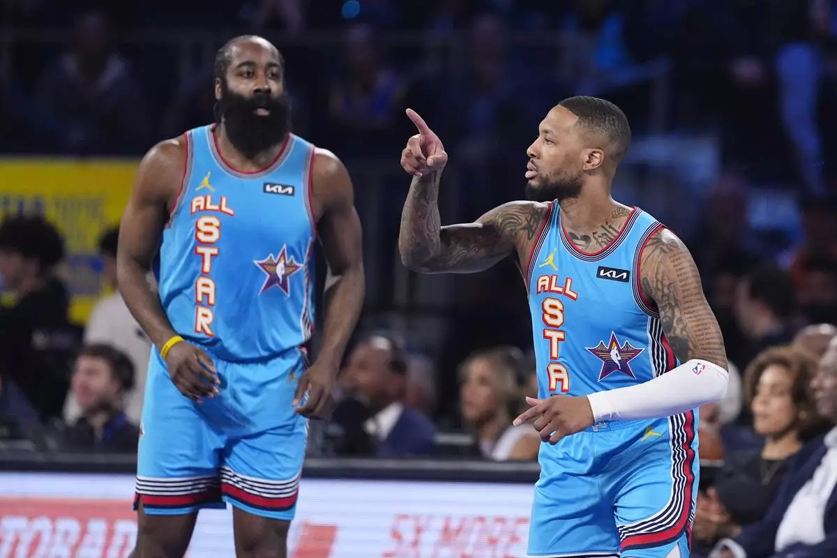 Milwaukee Bucks guard Damian Lillard, right, gestures next to Los Angeles Clipper guard James Harden during the NBA All-Star basketball game Sunday, Feb. 16, 2025, in San Francisco. (AP Photo/Godofredo A. Vásquez)