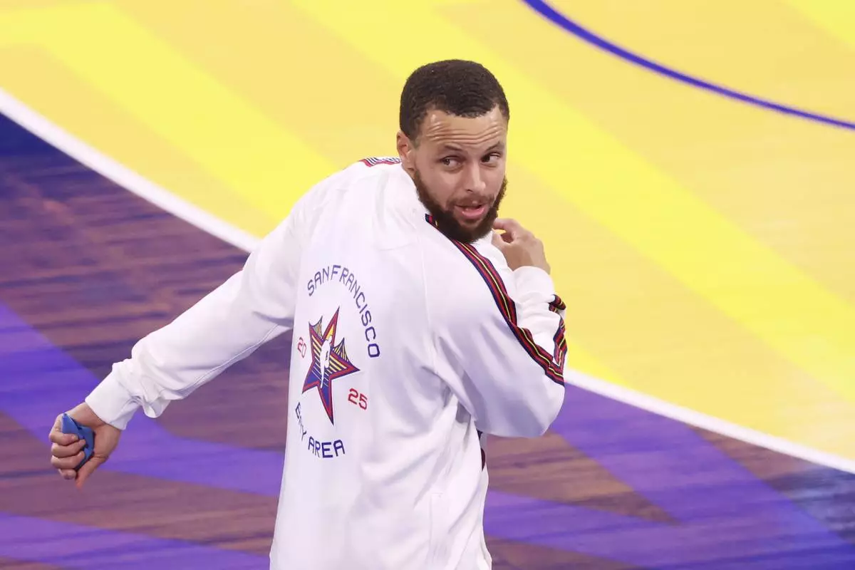 Golden State Warriors guard Stephen Curry warms up before the NBA All-Star basketball game Sunday, Feb. 16, 2025, in San Francisco. (AP Photo/Jed Jacobsohn)