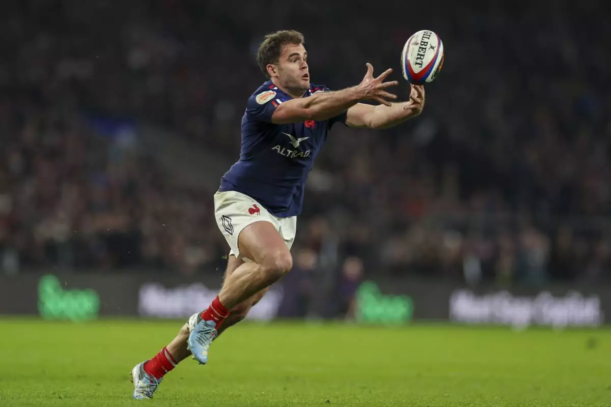 France's Damian Penaud drops the ball during the Six Nations rugby union match between England and France at Twickenham in London, Saturday, Feb. 8, 2025. (AP Photo/Ian Walton)