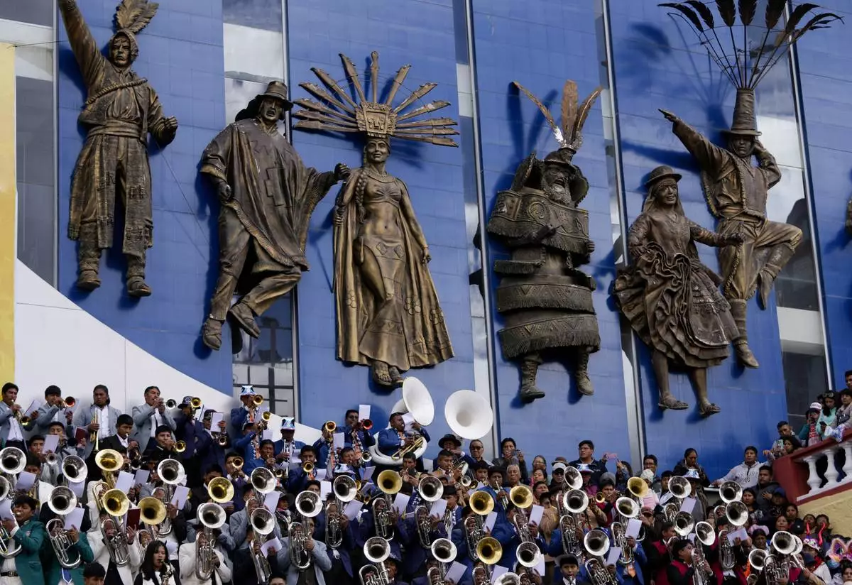 Band musicians perform during a pre-carnival celebration in Oruro, Bolivia, Saturday, Feb. 22, 2025. (AP Photo/Juan Karita)