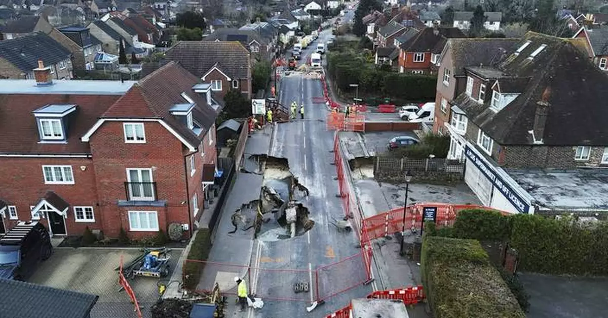 Sinkhole opens up on the main street of an English village