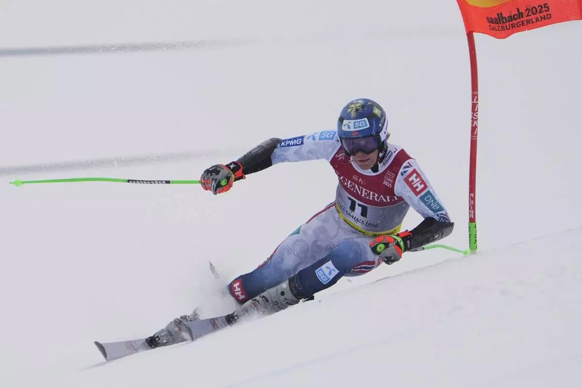 Norway's Timon Haugan competes in a men's giant slalom, at the Alpine Ski World Championships, in Saalbach-Hinterglemm, Austria, Friday, Feb. 14, 2025. (AP Photo/Giovanni Auletta)