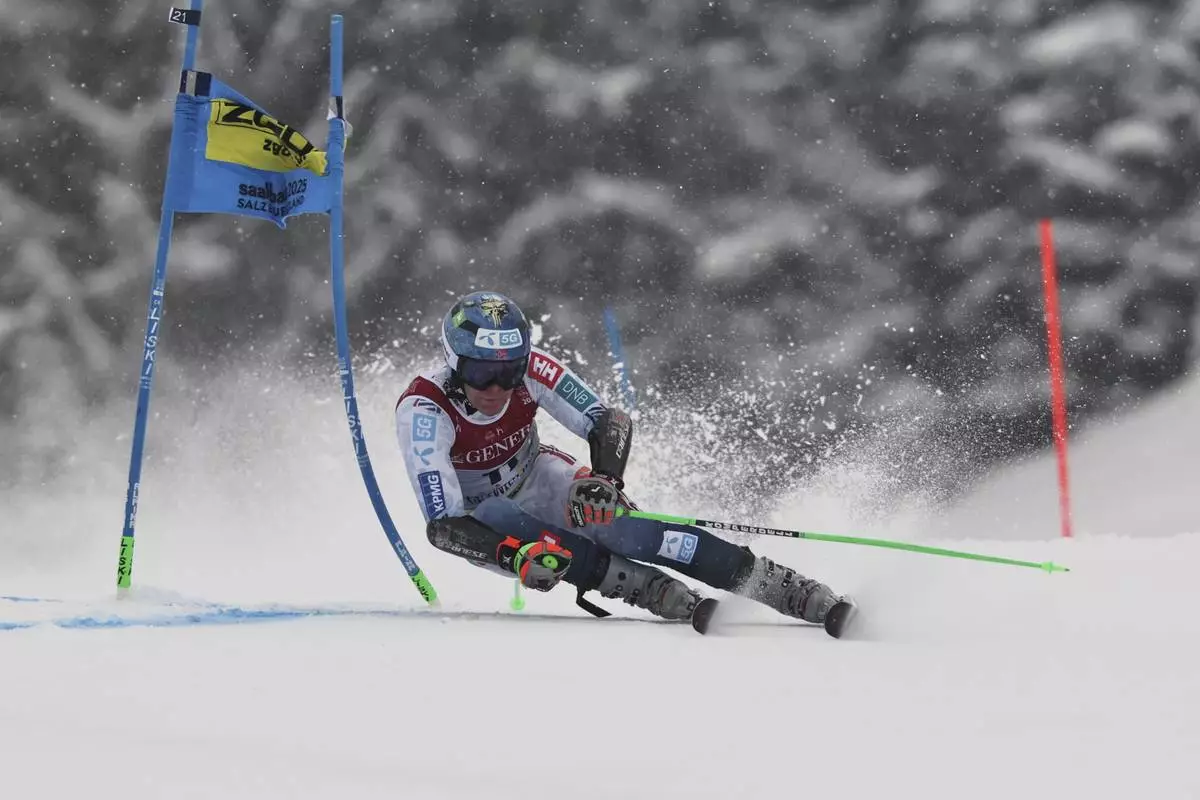 Norway's Timon Haugan competes in a men's giant slalom, at the Alpine Ski World Championships, in Saalbach-Hinterglemm, Austria, Friday, Feb. 14, 2025. (AP Photo/Marco Trovati)