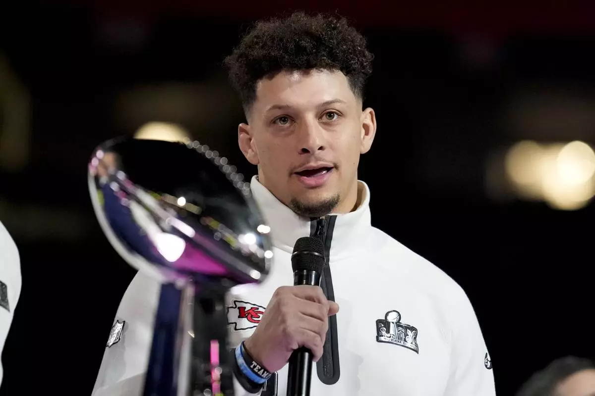 Kansas City Chiefs quarterback Patrick Mahomes (15) participates during Super Bowl 59 Opening Night, Monday, Feb. 3, 2025, in New Orleans, ahead of the NFL football game between the Philadelphia Eagles and the Kansas City Chiefs Sunday. (AP Photo/Brynn Anderson )