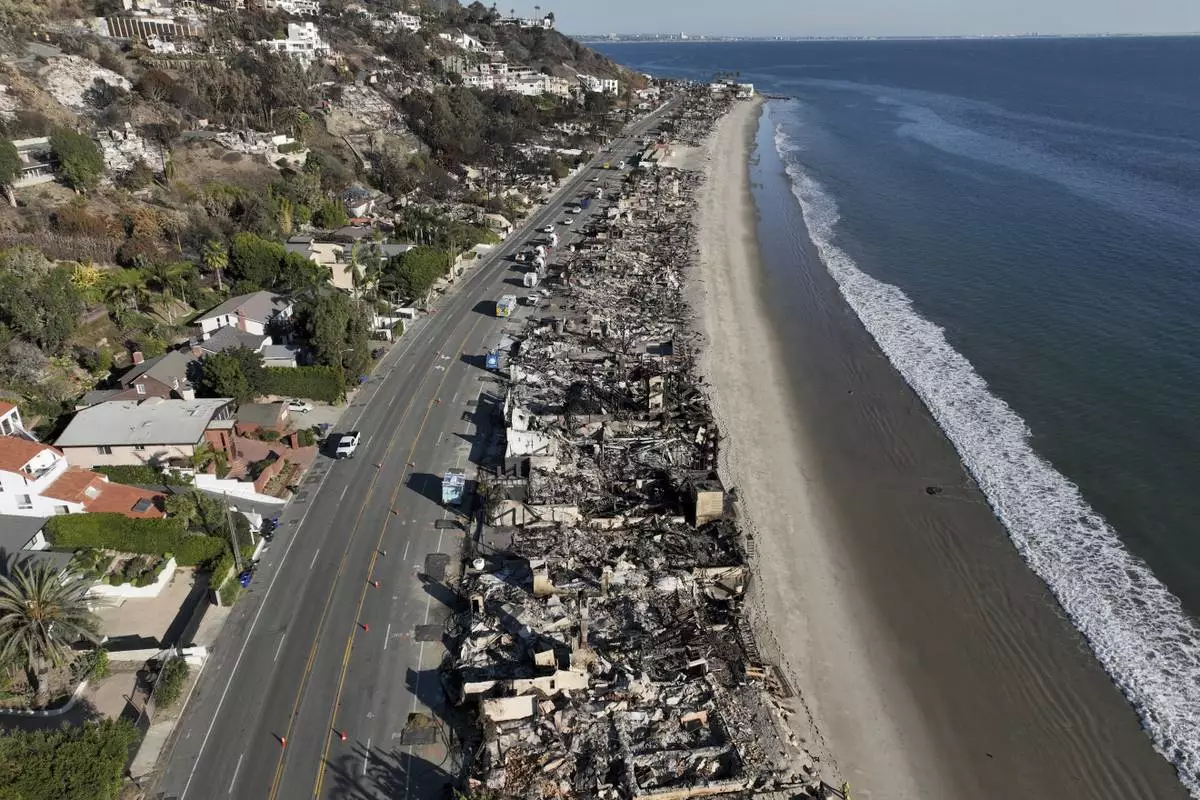 FILE - An aerial view shows the devastation from the Palisades Fire on beachfront homes Wednesday, Jan. 15, 2025 in Malibu, Calif. (AP Photo/Jae C. Hong, File)