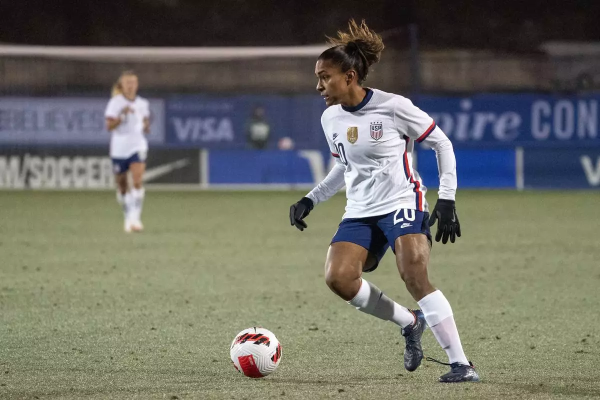 FILE - Unites States forward Catarina Macario (20) dribbles the ball during the first half of a She Believes Cup soccer match against Iceland, Wednesday, Feb. 23, 2022 in Frisco, Texas. (AP Photo/Jeffrey McWhorter, File)