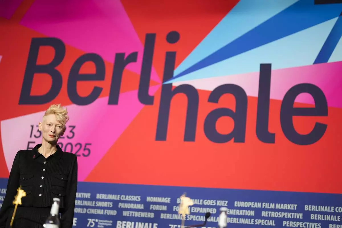Tilda Swinton arrives for a news conference for her Honorary Golden Bear for lifetime achievement at the International Film Festival, Berlinale, in Berlin, Friday, Feb. 14, 2025. (AP Photo/Markus Schreiber)