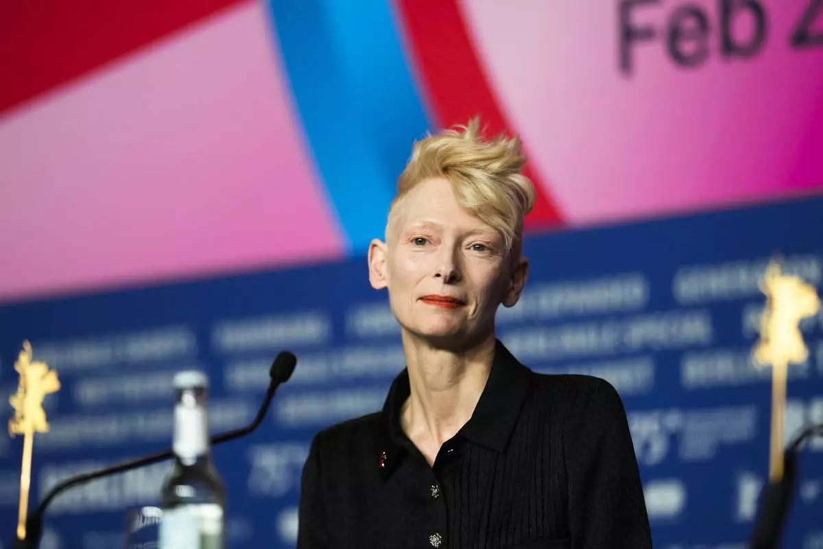 Tilda Swinton arrives for a news conference for her Honorary Golden Bear for lifetime achievement at the International Film Festival, Berlinale, in Berlin, Friday, Feb. 14, 2025. (AP Photo/Markus Schreiber)