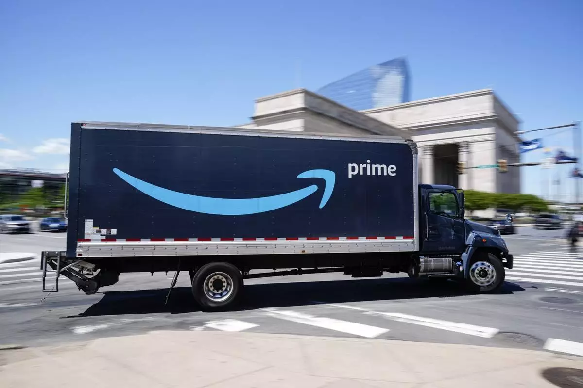 FILE - An Amazon truck drives in in Philadelphia, Friday, April 30, 2021. (AP Photo/Matt Rourke, file)