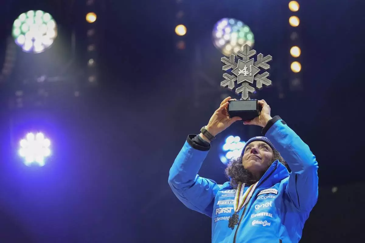 Italy's Federica Brignone shows her silver medal in a women's Super-G, at the Alpine Ski World Championships, in Saalbach-Hinterglemm, Austria, Thursday, Feb. 6, 2025. (AP Photo/Giovanni Auletta)