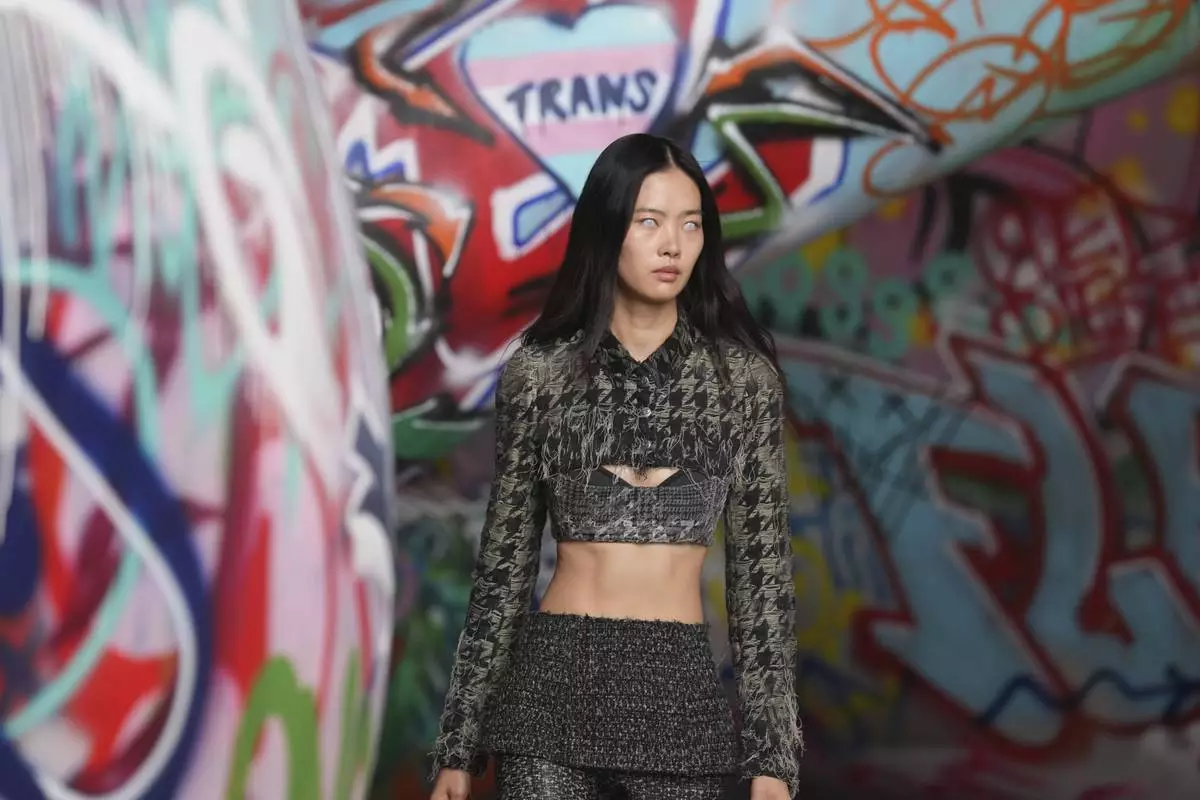 A model wears a creation of the Diesel Fall/Winter 2025-2026 women's collection presented in Milan, Italy, Wednesday, Feb. 26, 2025. (AP Photo/Antonio Calanni)