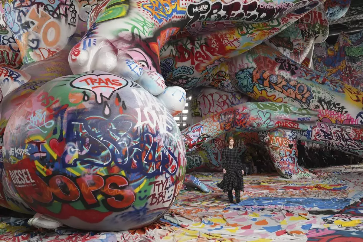 A model wears a creation of the Diesel Fall/Winter 2025-2026 women's collection presented in Milan, Italy, Wednesday, Feb. 26, 2025. (AP Photo/Antonio Calanni)