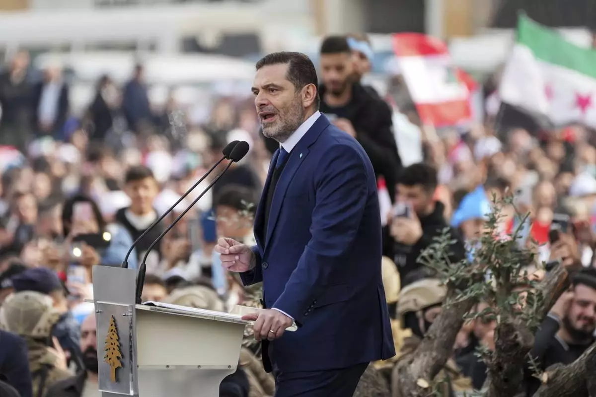 Former Lebanese Prime Minister Saad Hariri speaks during a ceremony to mark the 20th anniversary of the assassination of his father, former Prime Minister Rafik Hariri after he paid his respects at the grave of his father, in Beirut, Lebanon, Friday, Feb. 14, 2025. (AP Photo/Hassan Ammar)