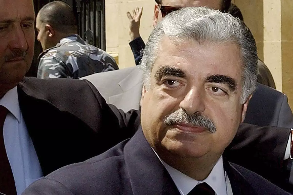 FILE - Lebanese Prime Minister-designate Rafik Hariri leaves the Parliament building in Beirut, Lebanon, on April 17, 2003. (AP Photo/File)
