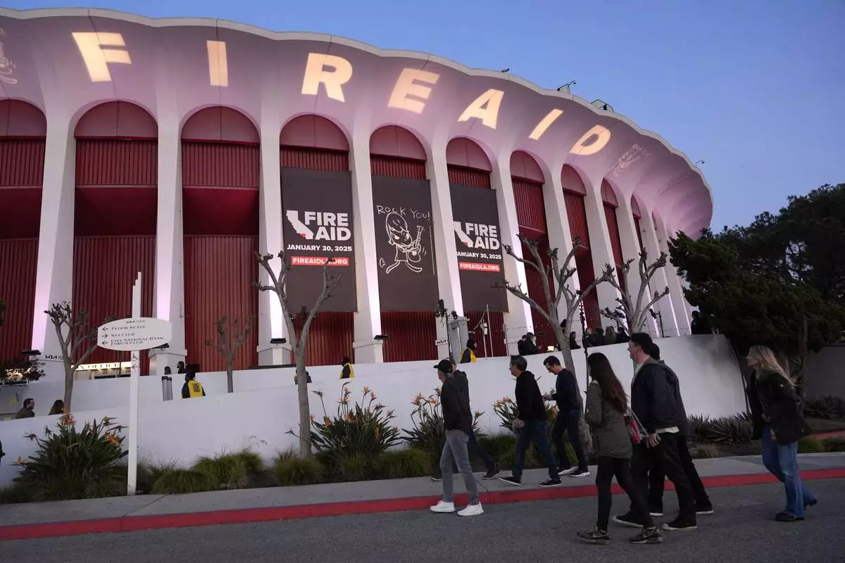 A general view of atmosphere is pictured outside the Forum prior to the FireAid benefit concert on Thursday, Jan. 30, 2025, in Inglewood, Calif. (AP Photo/Chris Pizzello)