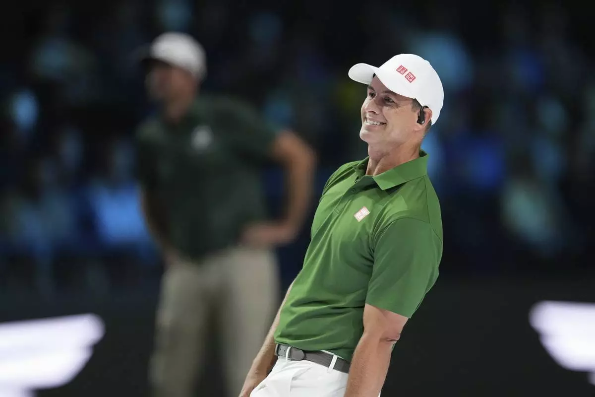 Adam Scott of Boston Common Golf leans as he follows his shot on the seventh hole during a match of the TMRW Golf League (TGL) against Jupiter Links Golf Club, Monday, Jan. 27, 2025, in Palm Beach Gardens, Fla. (AP Photo/Rebecca Blackwell)