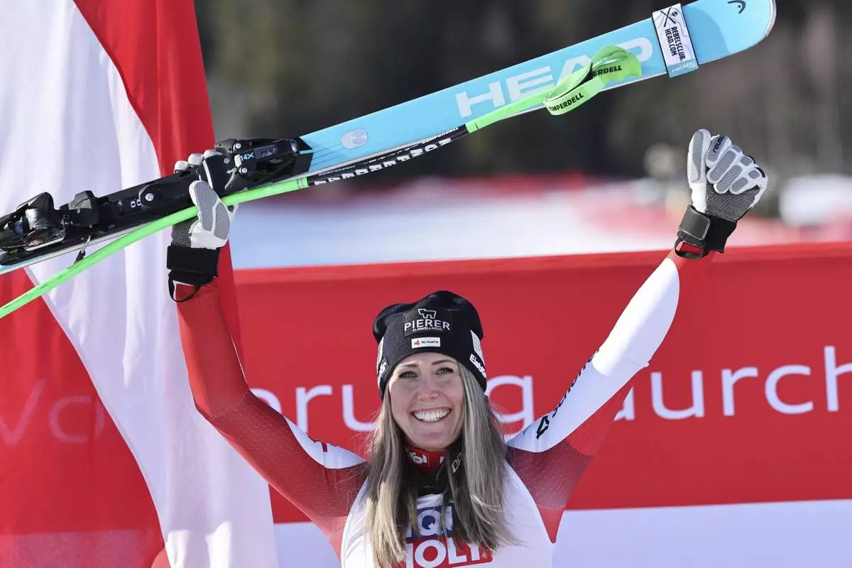 The winner Austria's Cornelia Huetter celebrates after an alpine ski, women's World Cup downhill, in Kvitfjell, Norway, Friday, Feb. 28, 2025. (AP Photo/Marco Trovati)