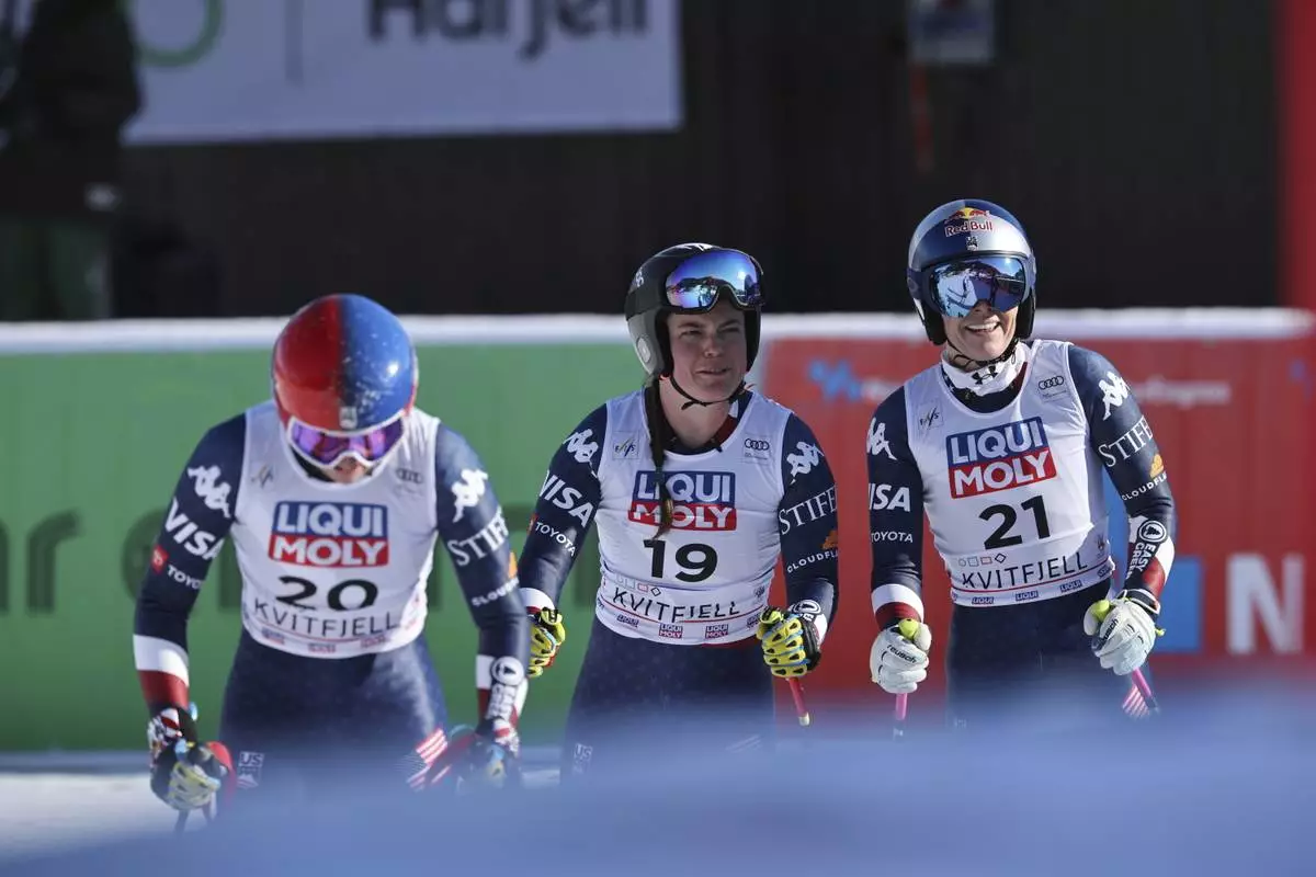 From left, United States' Lauren Macuga, United States' Breezy Johnson and US Lindsey Vonnr after completing an alpine ski, women's World Cup downhill, in Kvitfjell, Norway, Friday, Feb. 28, 2025. (AP Photo/Marco Trovati)