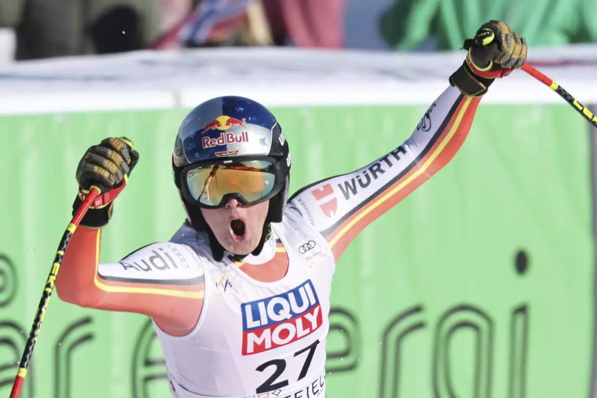Germany's Emma Aicher reacts after completing an alpine ski, women's World Cup downhill, in Kvitfjell, Norway, Friday, Feb. 28, 2025. (AP Photo/Marco Trovati)