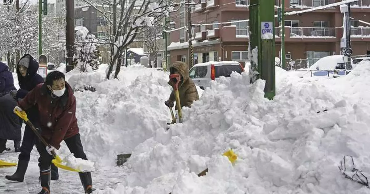 Parts of northern Japan have 4 feet of snow and more is falling