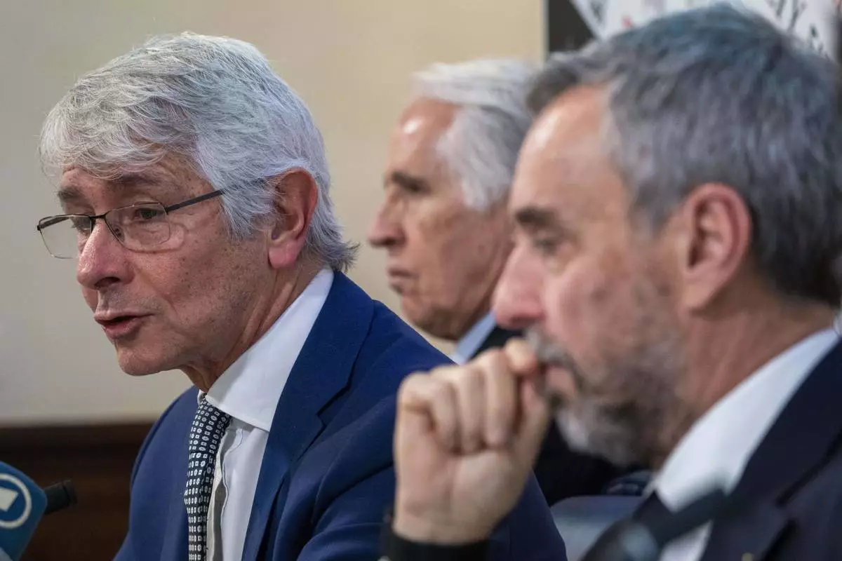 From left, Italian MInister of Sports Andrea Bodi, Milano Cortina 2026 Foundation President Giovanni Malago and Foundation CEO Andrea Vernier attend a press conference at the Foreign Press Club in Rome, Tuesday, Feb. 18, 2025, on the next Winter Olympic Games that will start in Italy in February 2026. (AP Photo/Domenico Stinellis)