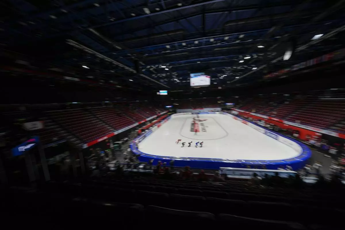 Athletes compete during the Women's 1500 mt. quarterfinal race of the ISU Short Track World Tour, Olympics Milano-Cortina 2026 test event, in Milan, Italy, Friday, Feb. 14, 2025. (AP Photo/Luca Bruno)