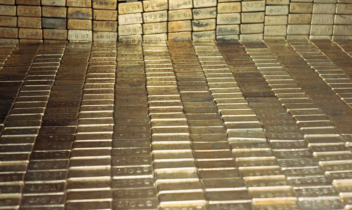 FILE - Gold bars are stored at the U.S. Depository in Ft. Knox, Kentucky, Sept. 24, 1974. (AP Photo/Barry Thumma, File)