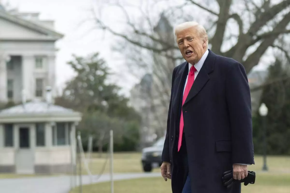 President Donald Trump responds to reporters as he walks on the South Lawn upon arrival at the White House, Saturday, Feb. 22, 2025, in Washington. (AP Photo/Manuel Balce Ceneta)