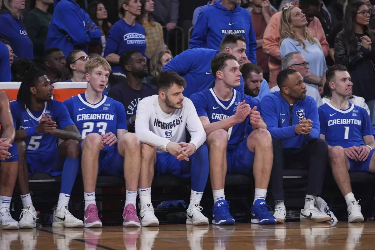 Creighton's Jamiya Neal (5), Jackson McAndrew (23) and Steven Ashworth (1) watch during the second half of an NCAA college basketball game against the St. John's in the championship of the Big East Conference tournament Saturday, March 15, 2025, in New York. (AP Photo/Frank Franklin II)