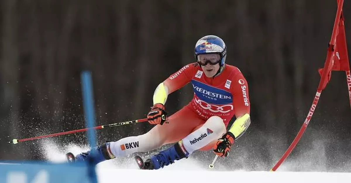 Swiss ski star Odermatt secures overall and GS World Cup titles in race won by teammate Meillard