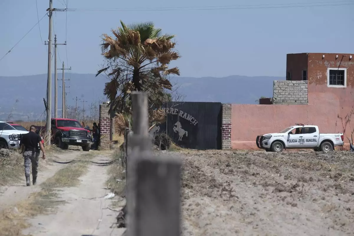 Police guard access to Izaguirre Ranch in Teuchitlan, Jalisco state, Mexico, Tuesday, March 11, 2025. (AP Photo/Alfredo Moya)