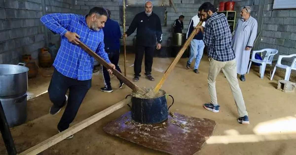 AP PHOTOS: A Libyan town comes together to make a beloved Ramadan dish