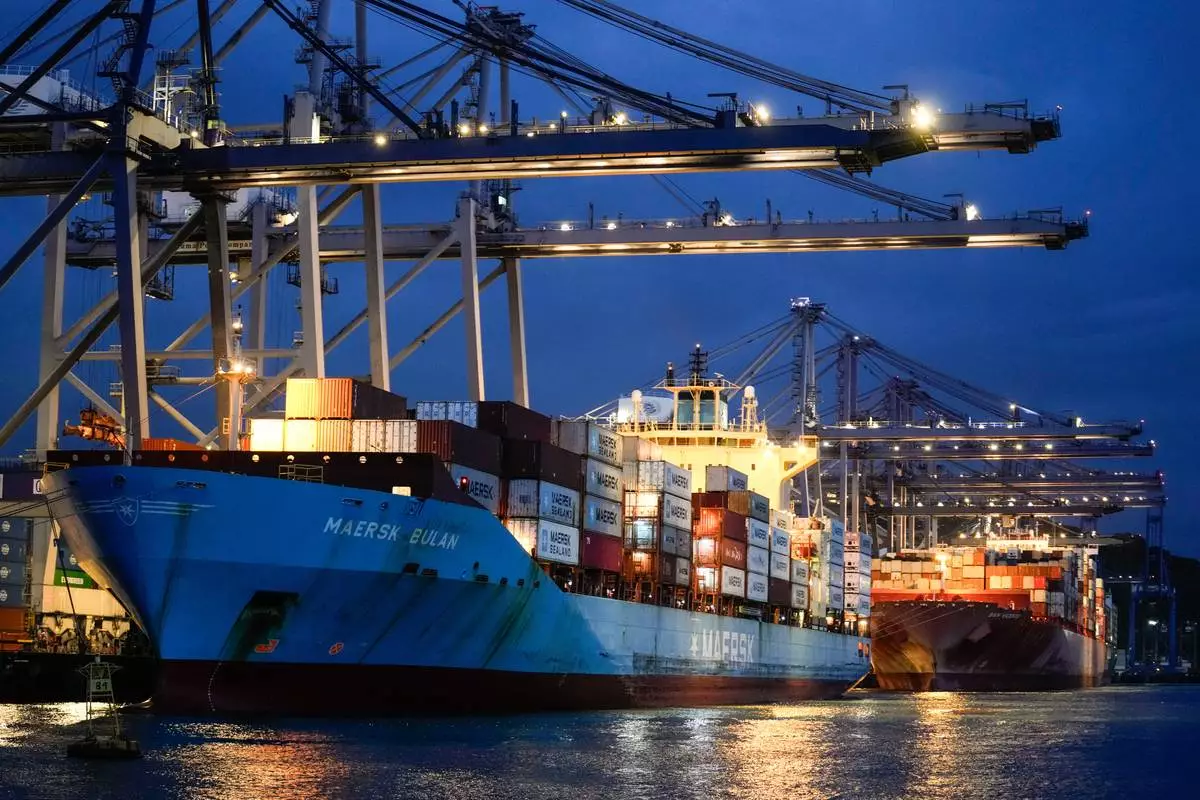 FILE - Cranes load a cargo ship at the Panama Canal's Balboa Port in Panama City, Sept. 9, 2024. (AP Photo/Matias Delacroix, File)