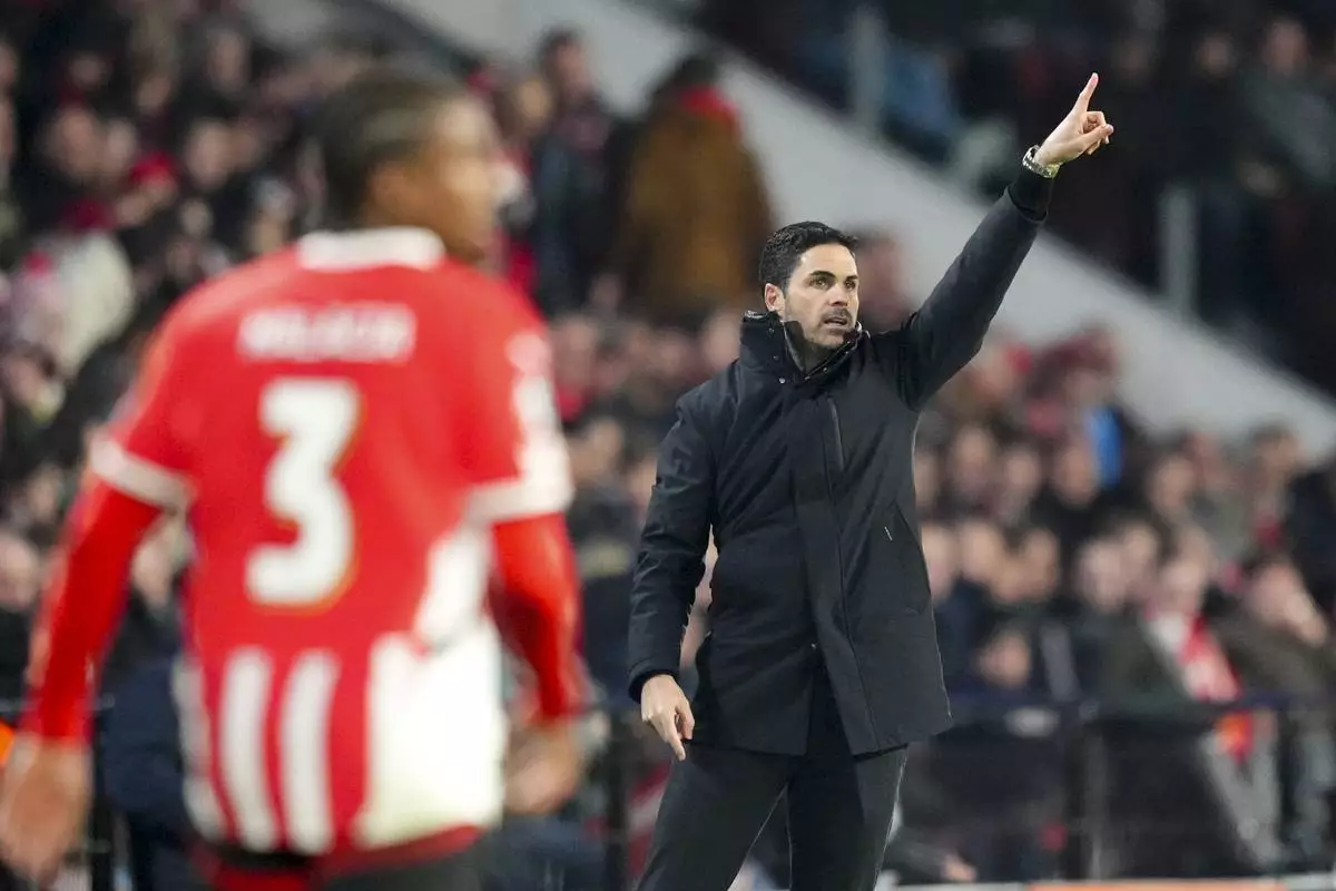 Arsenal's manager Mikel Arteta gestures during the Champions League, round of 16, first leg soccer match between PSV and Arsenal at the Phillips Stadium in Eindhoven, Netherlands, Tuesday, March 4, 2025. (AP Photo/Peter Dejong)
