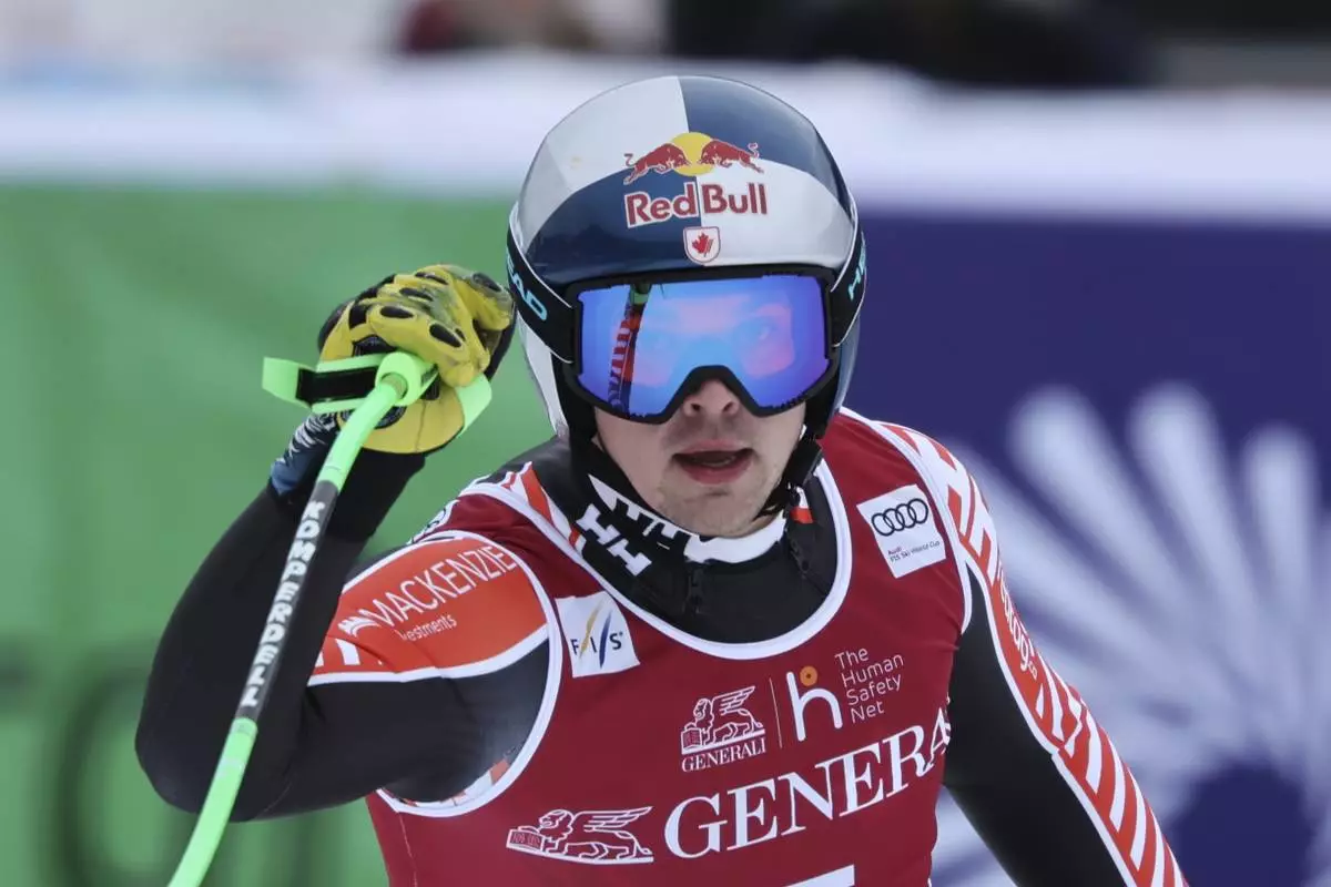 Canada's James Crawford reacts after completing an alpine ski, men's World Cup downhill, in Kvitfjell, Norway, Saturday, March 8, 2025. (AP Photo/Marco Trovati)