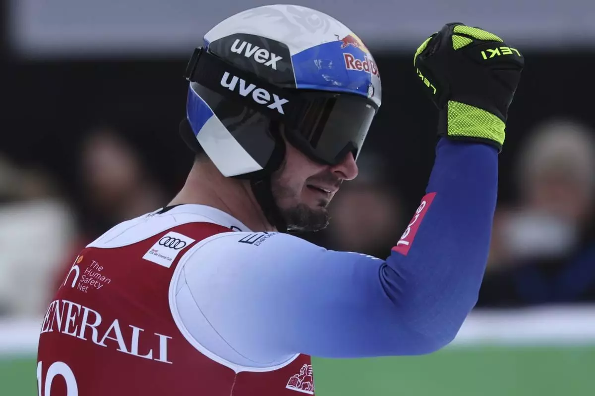 Italy's Dominik Paris reacts after completing an alpine ski, men's World Cup downhill, in Kvitfjell, Norway, Saturday, March 8, 2025. (AP Photo/Marco Trovati)