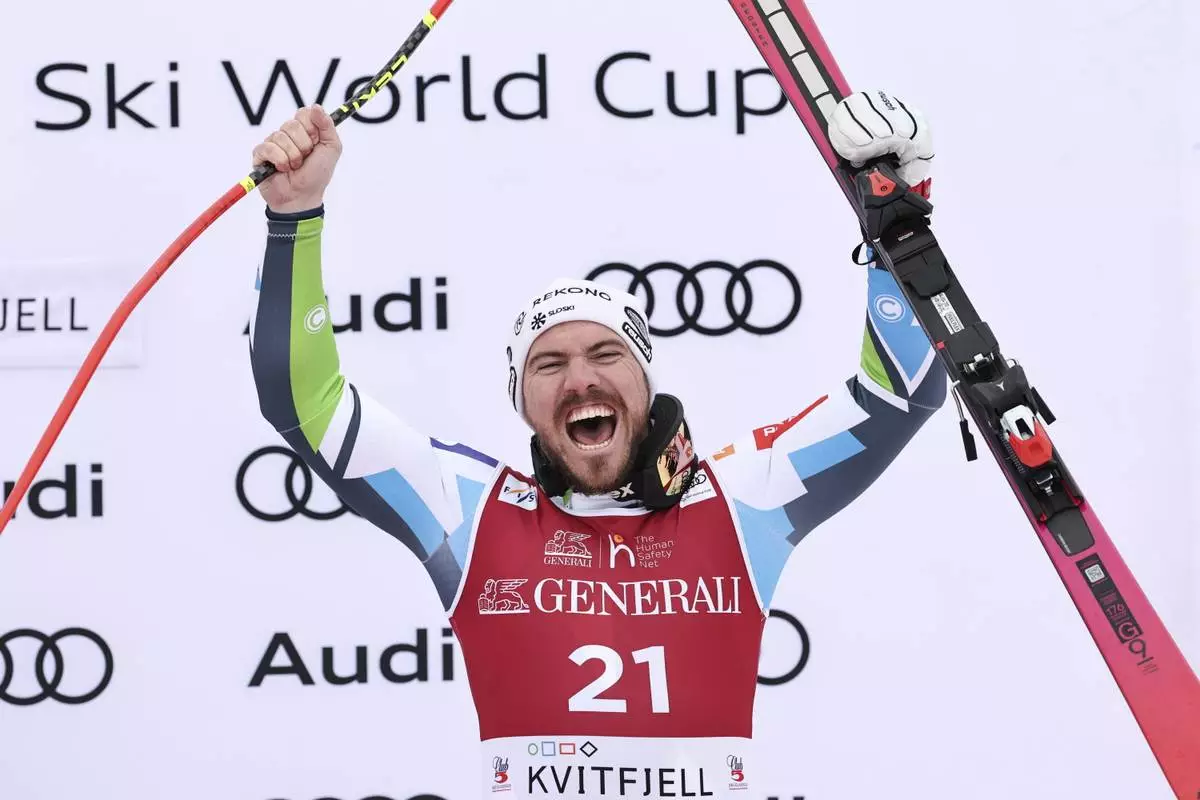 Third placed Slovenia's Miha Hrobat celebrates after an alpine ski, men's World Cup downhill, in Kvitfjell, Norway, Saturday, March 8, 2025. (AP Photo/Marco Trovati)