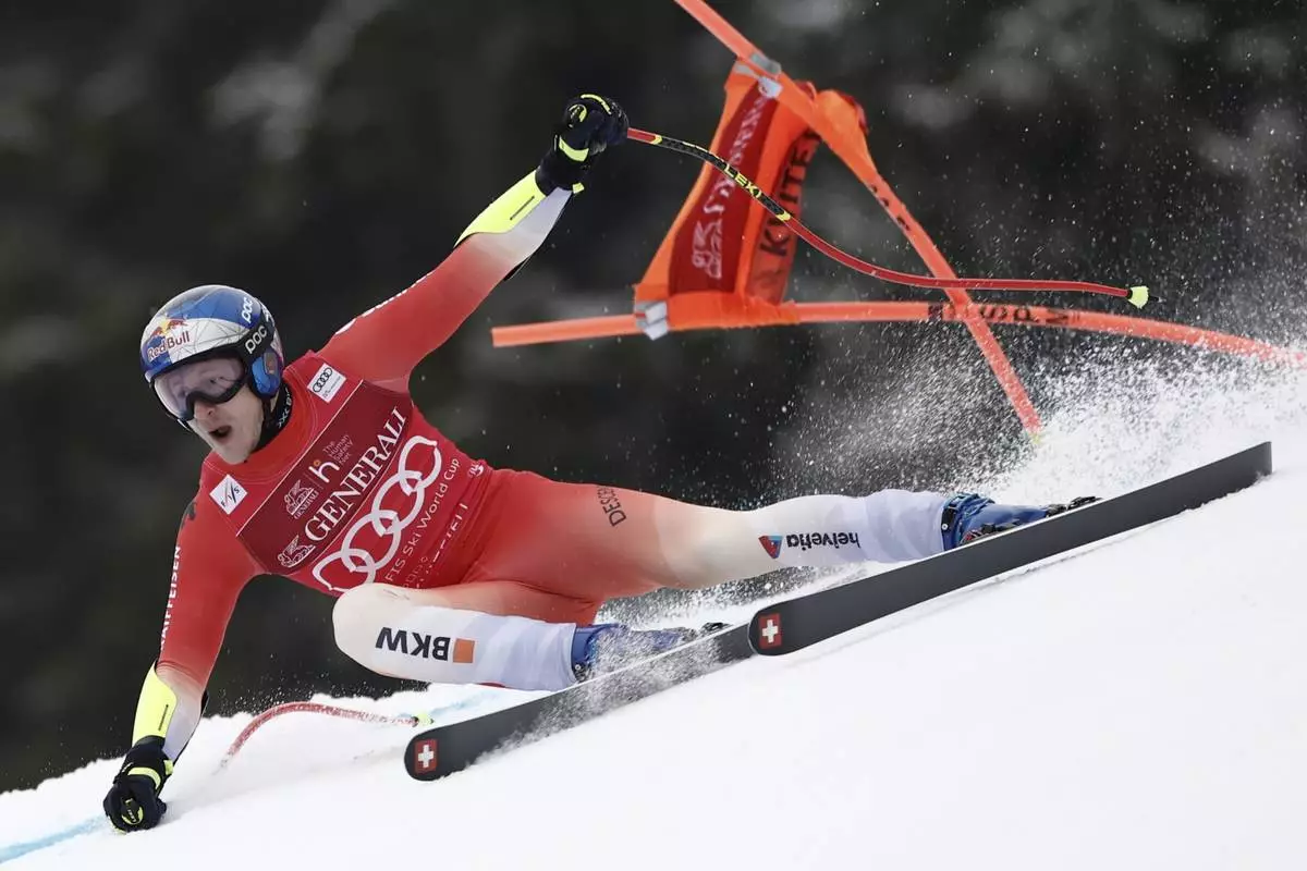 Switzerland's Marco Odermatt speeds down the course during an alpine ski, men's World Cup super G race, in Kvitfjell, Norway, Sunday, March 9, 2025. (AP Photo/Gabriele Facciotti)