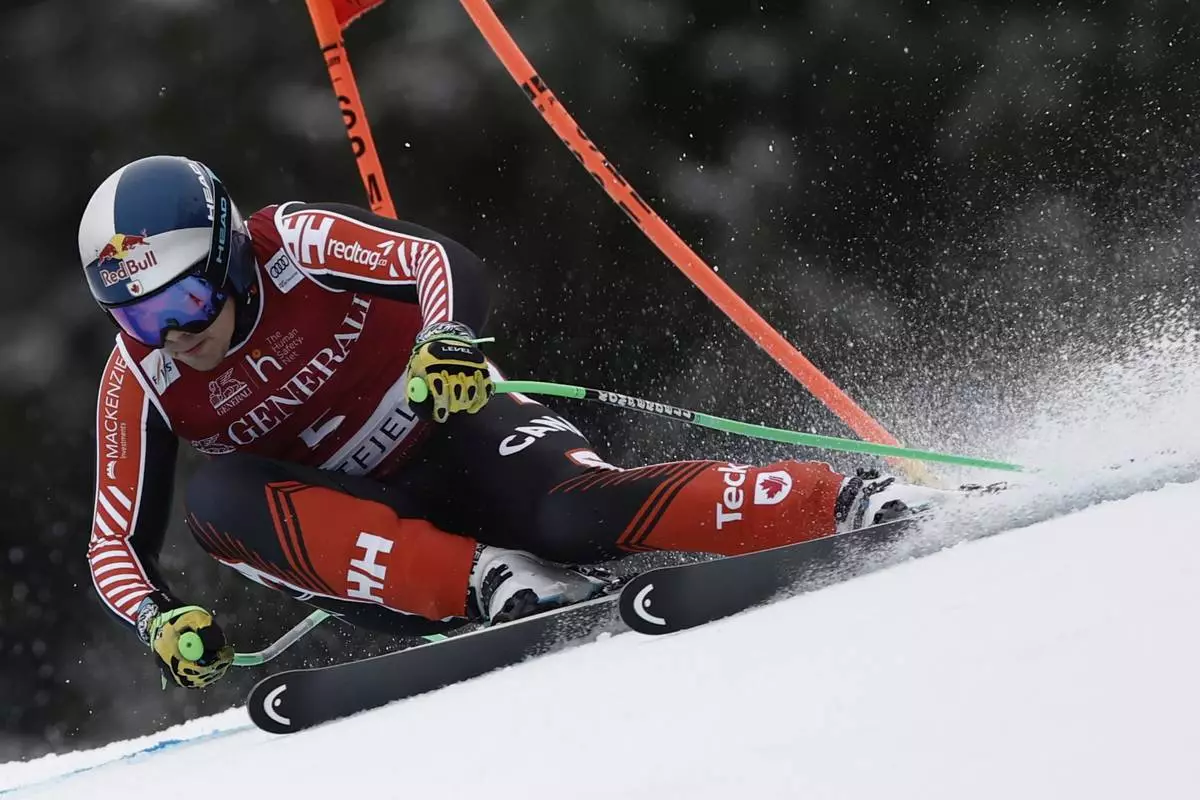 Canada's James Crawford speeds down the course during an alpine ski, men's World Cup super G race, in Kvitfjell, Norway, Sunday, March 9, 2025. (AP Photo/Gabriele Facciotti)