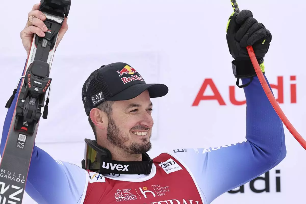 The winner Italy's Dominik Paris celebrates after an alpine ski, men's World Cup downhill, in Kvitfjell, Norway, Saturday, March 8, 2025. (AP Photo/Marco Trovati)