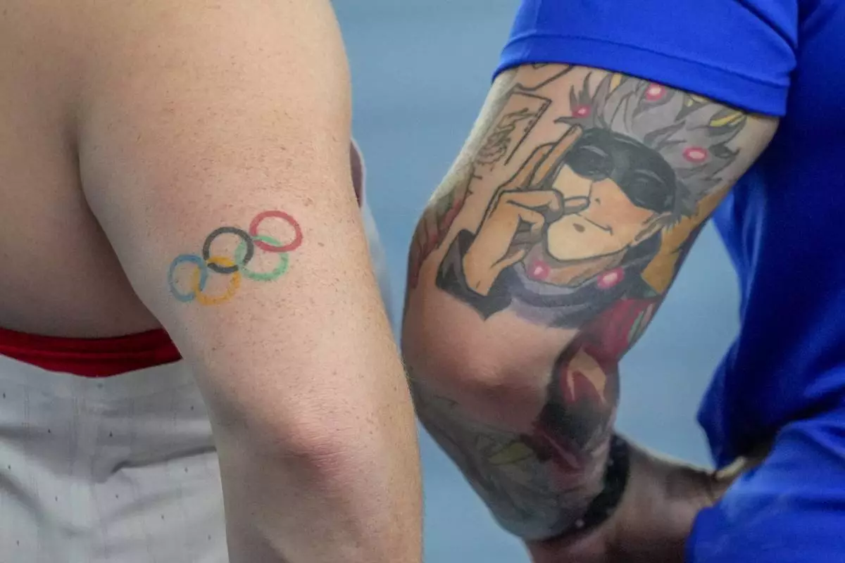 Sarah Mitton of Canada, left, and Chase Jackson, of the United States, participate in the women's Shot Put final during the World Athletics Indoor Championships in Nanjing, China, Friday, March 21, 2025. (AP Photo/Dar Yasin)