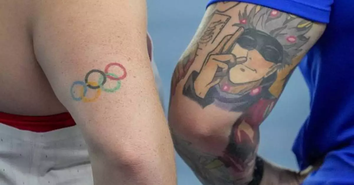AP PHOTOS: Athletes showcase tattoos of Olympic rings, lions and superheroes at World Indoors